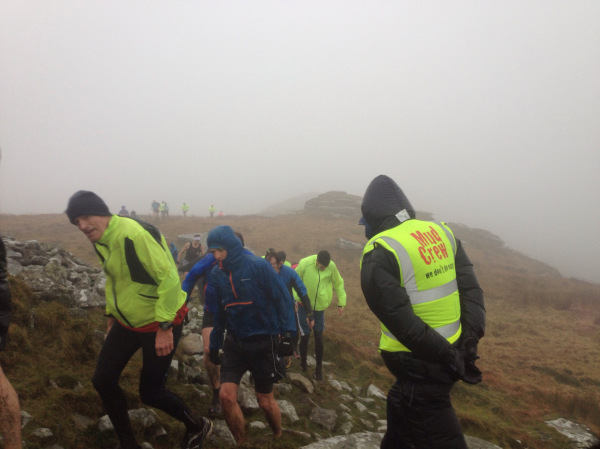 Runners approaching the very windswept Brown Willy